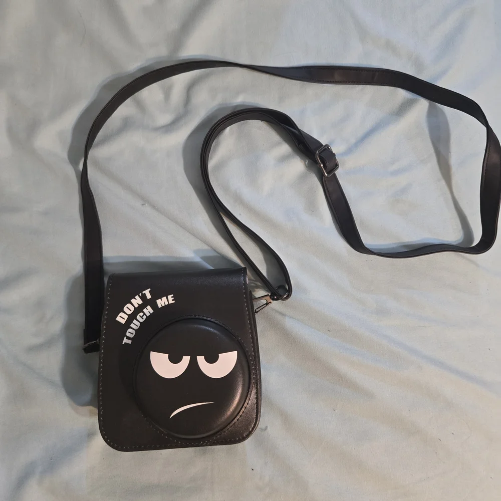 Black Camera Crossbody Bag with Graphic Design